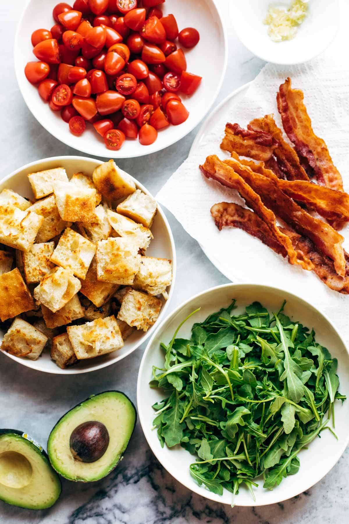 Ingredients for BLT Panzanella in bowls.