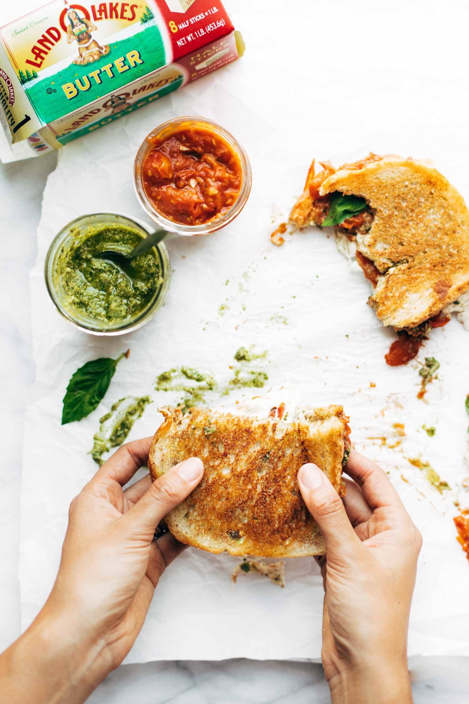 Caprese Grilled Cheese with pesto and tomato sauce.