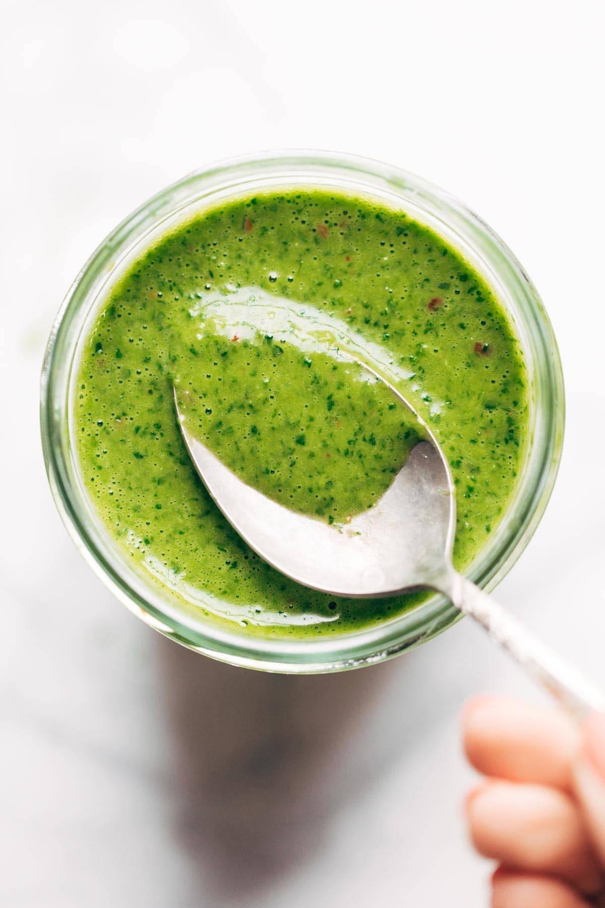 Cilantro Vinaigrette in jar with spoon.