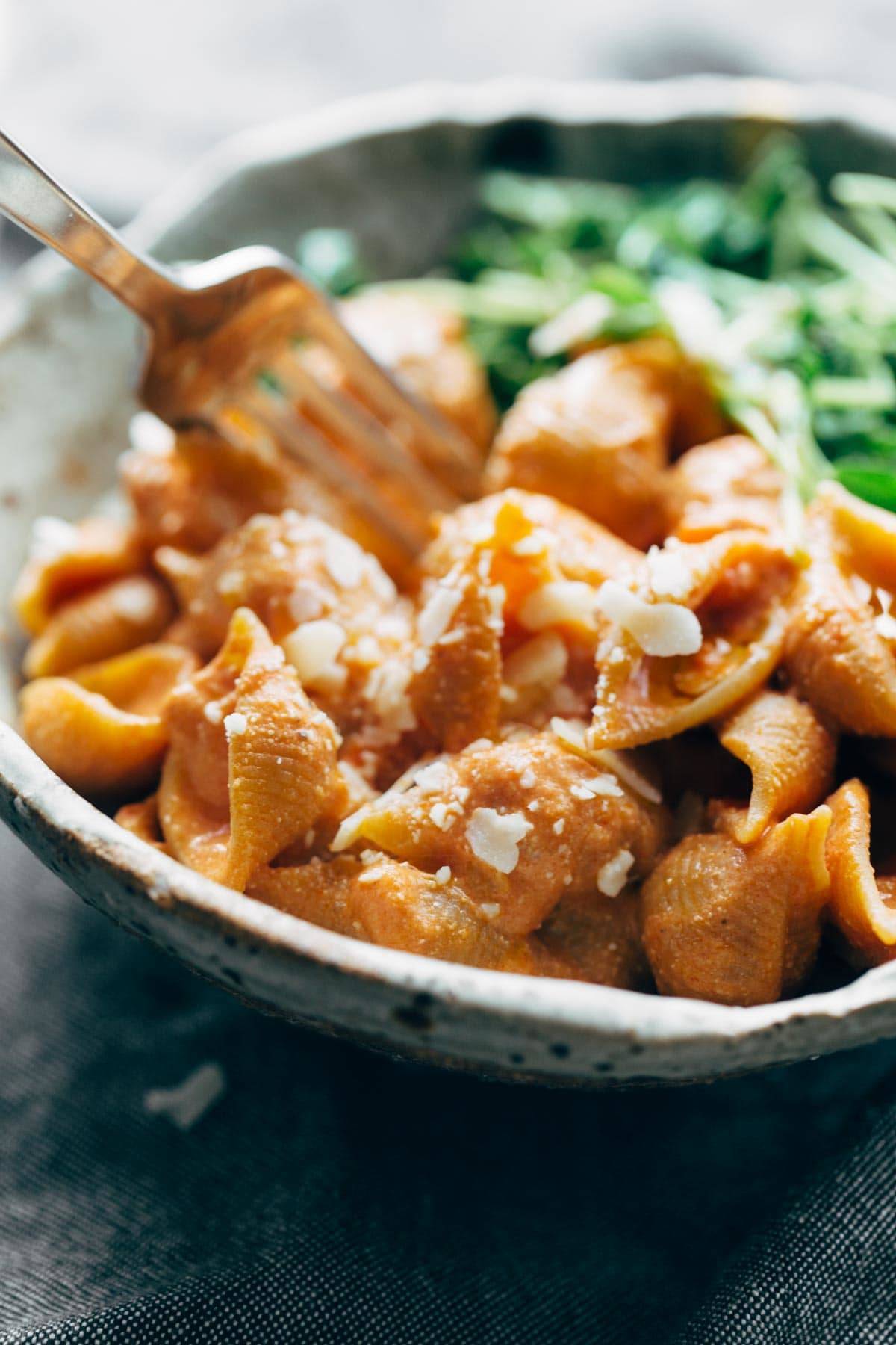 Three Ingredient Creamy Tomato Shells in a bowl with a fork.