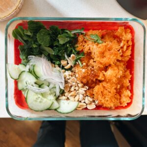 Crispy rice salad in a glass container.