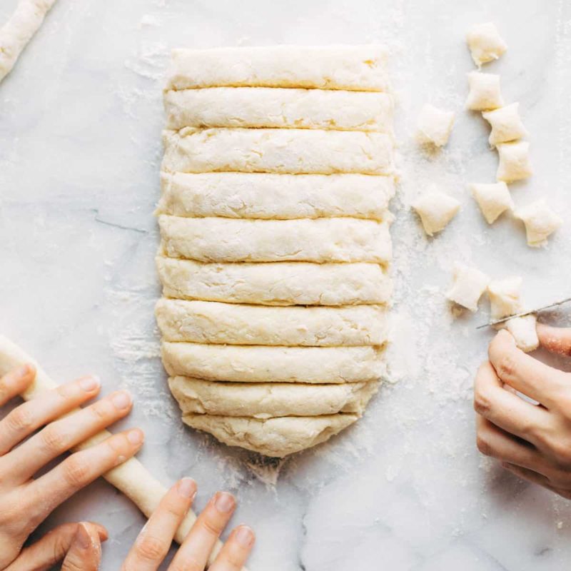 Rolling and cutting homemade gnocchi.