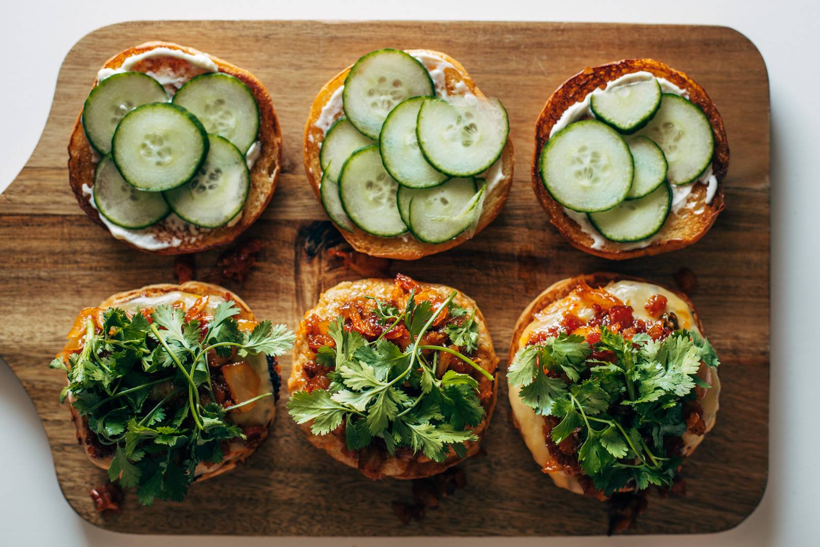 Cilantro being added to chicken burgers