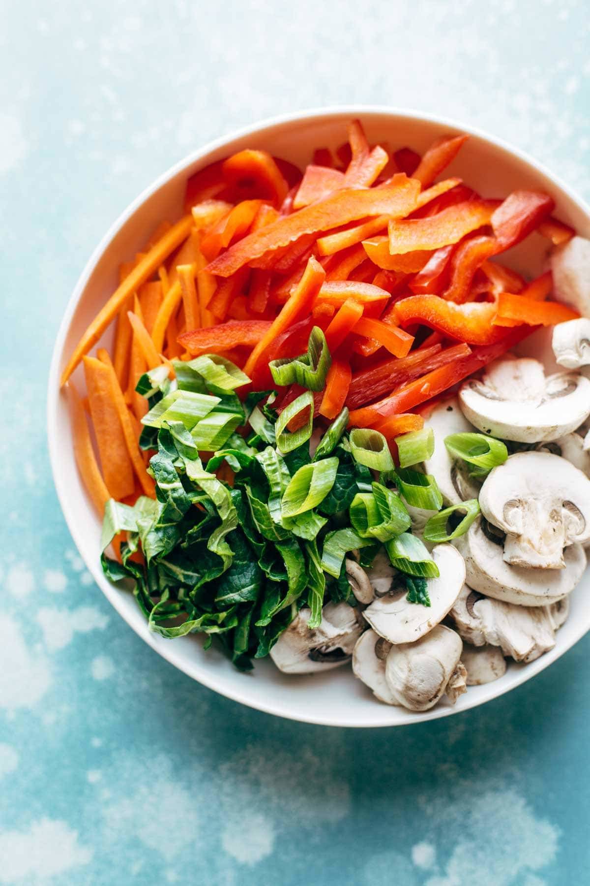 White bowl filled with vegetables for Lo Mein. 