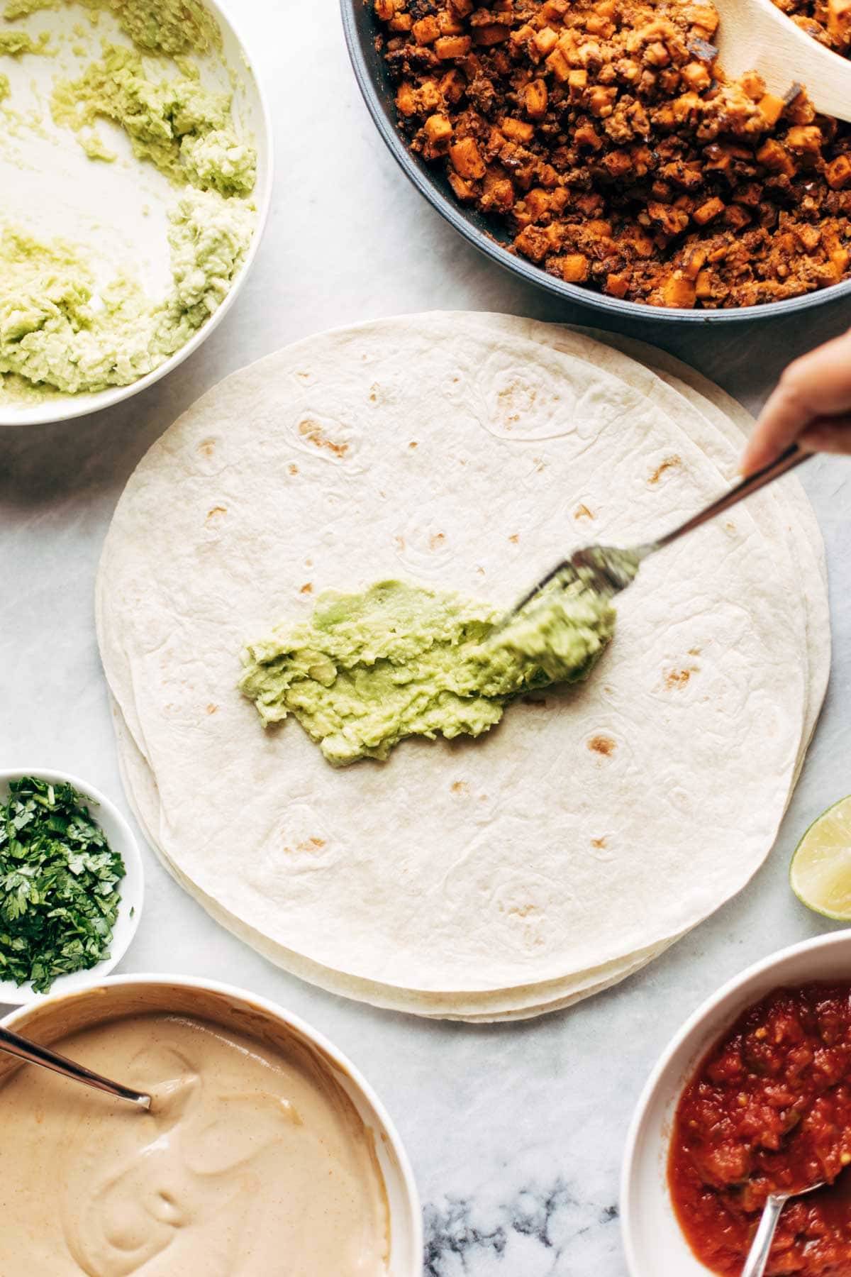 Avocado spread on tortilla.