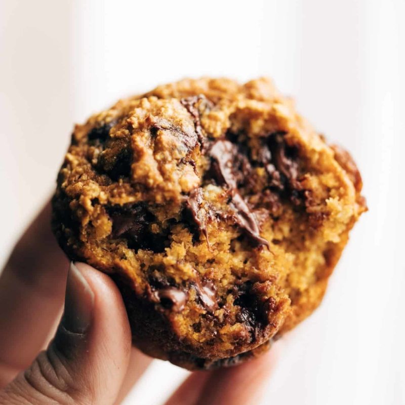 A half-bitten pumpkin muffin.