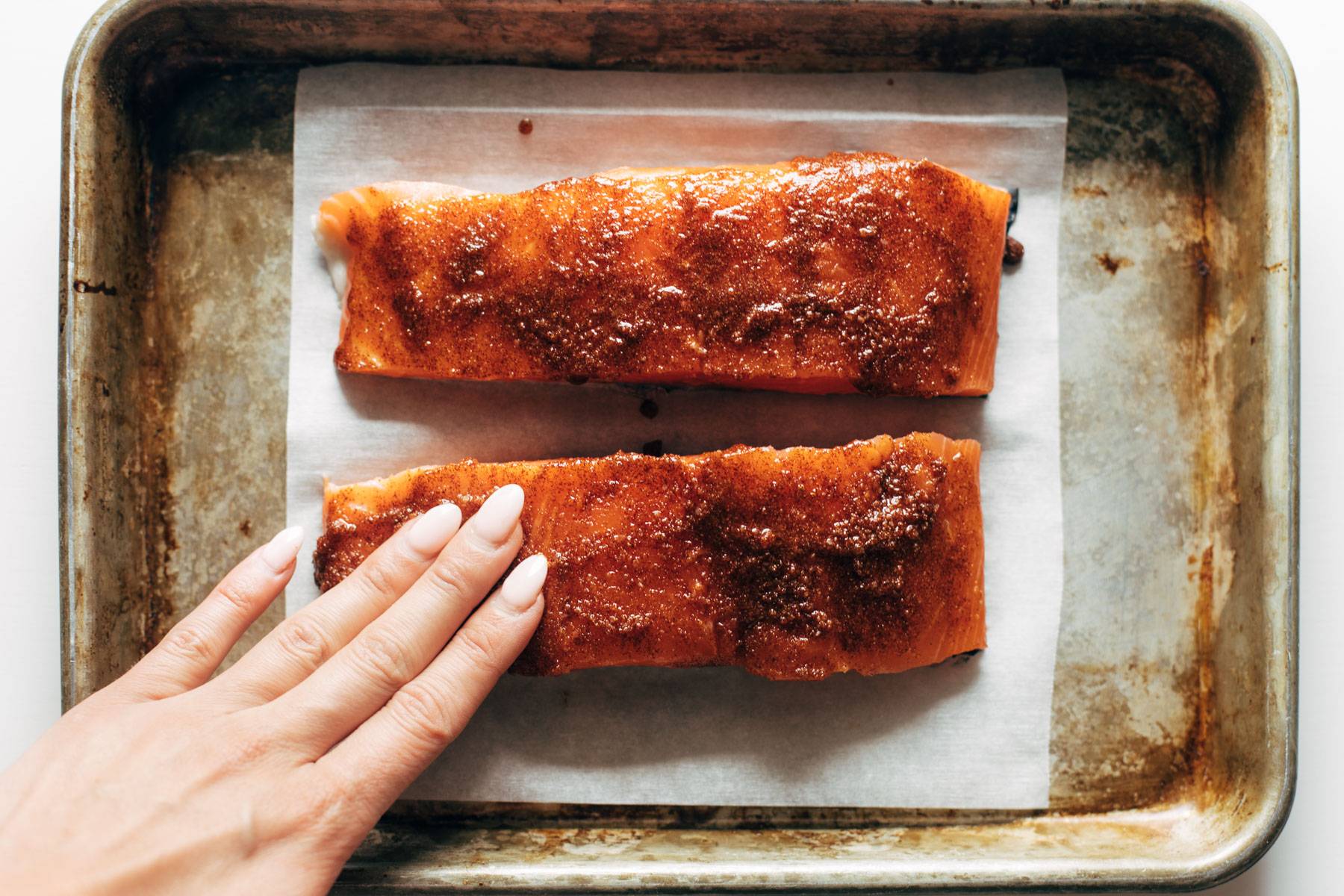 Salmon with rub on a baking sheet