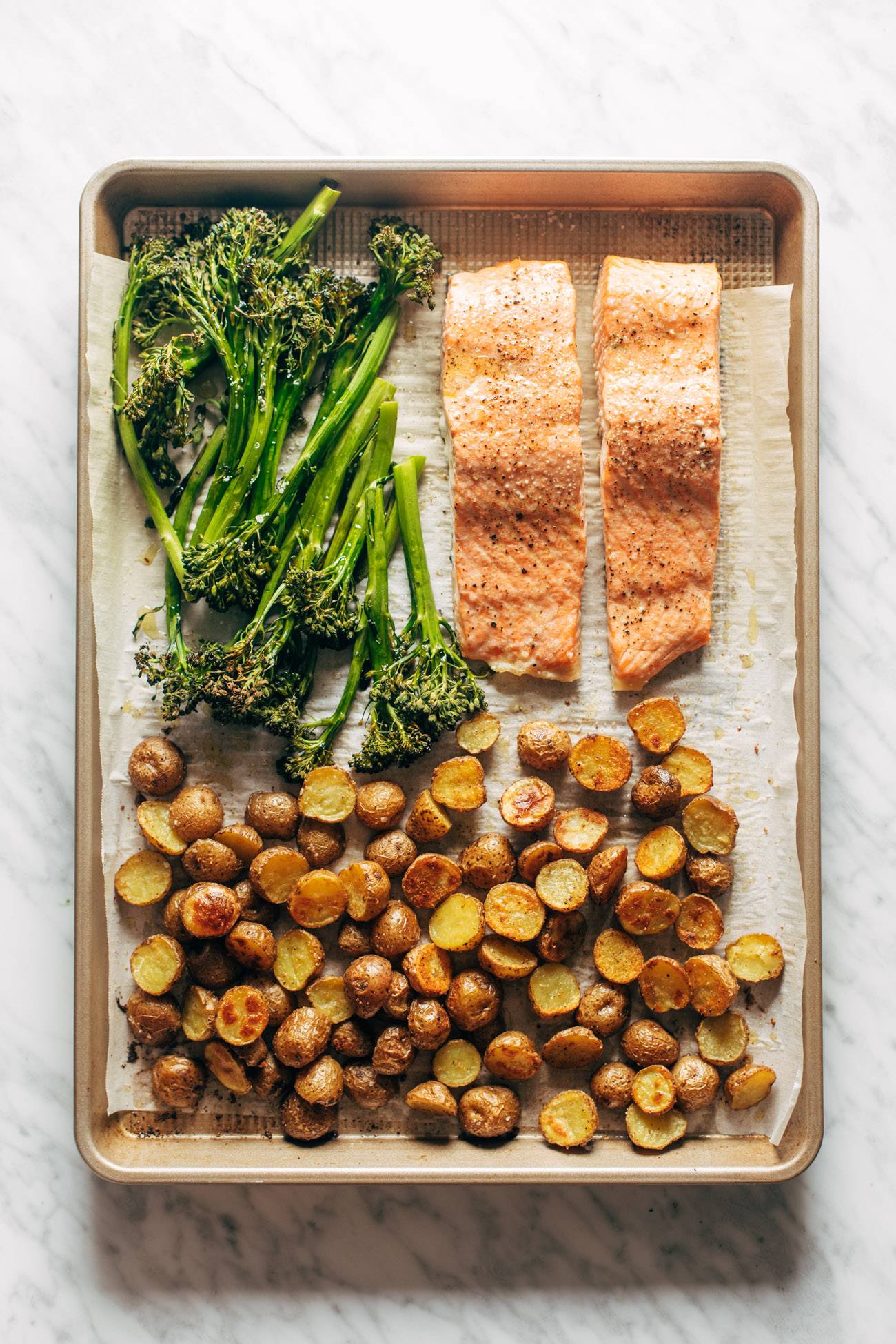 Salmon, potatoes, and broccoli on a sheet pan