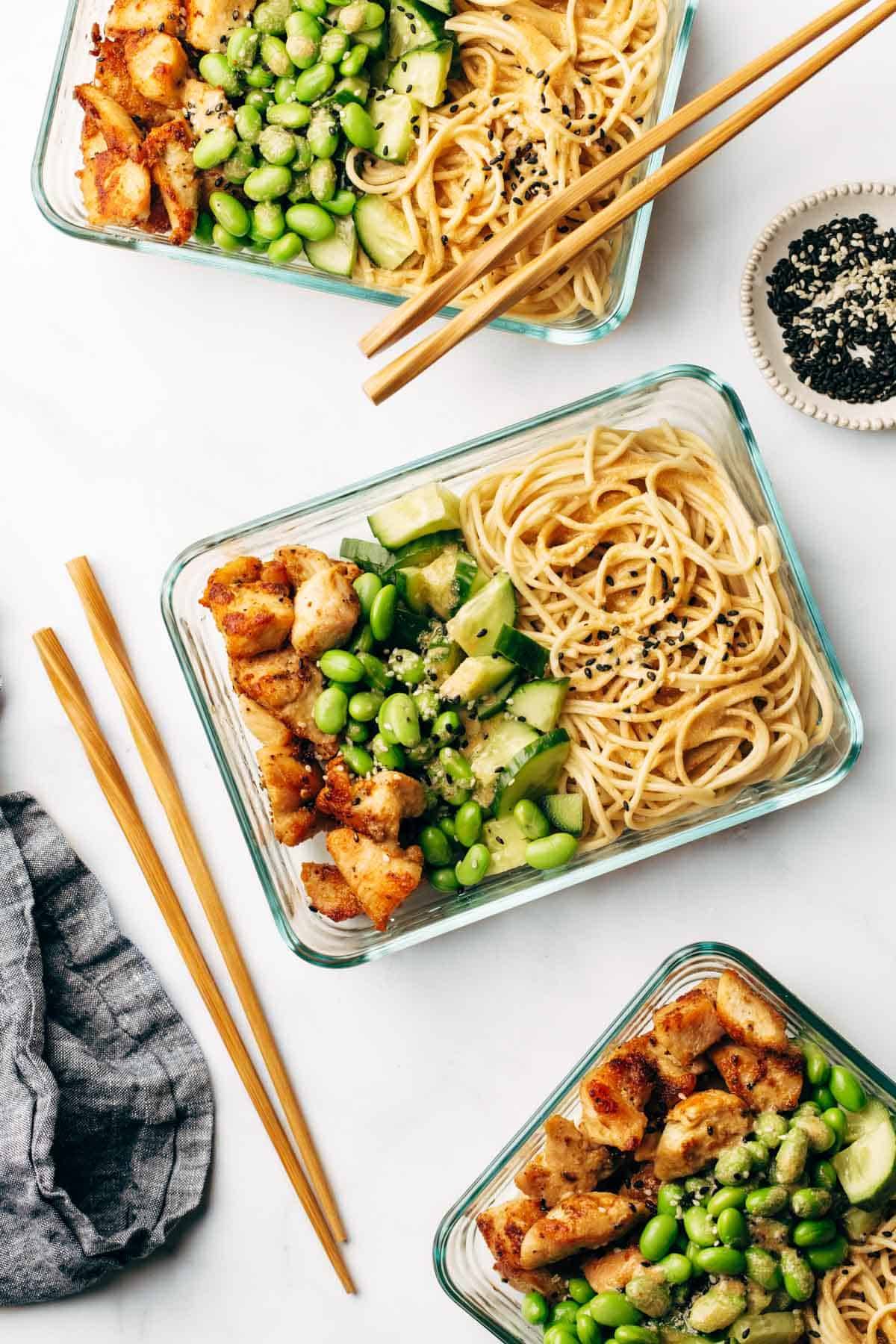 Sesame noodle bowls in meal prep containers.