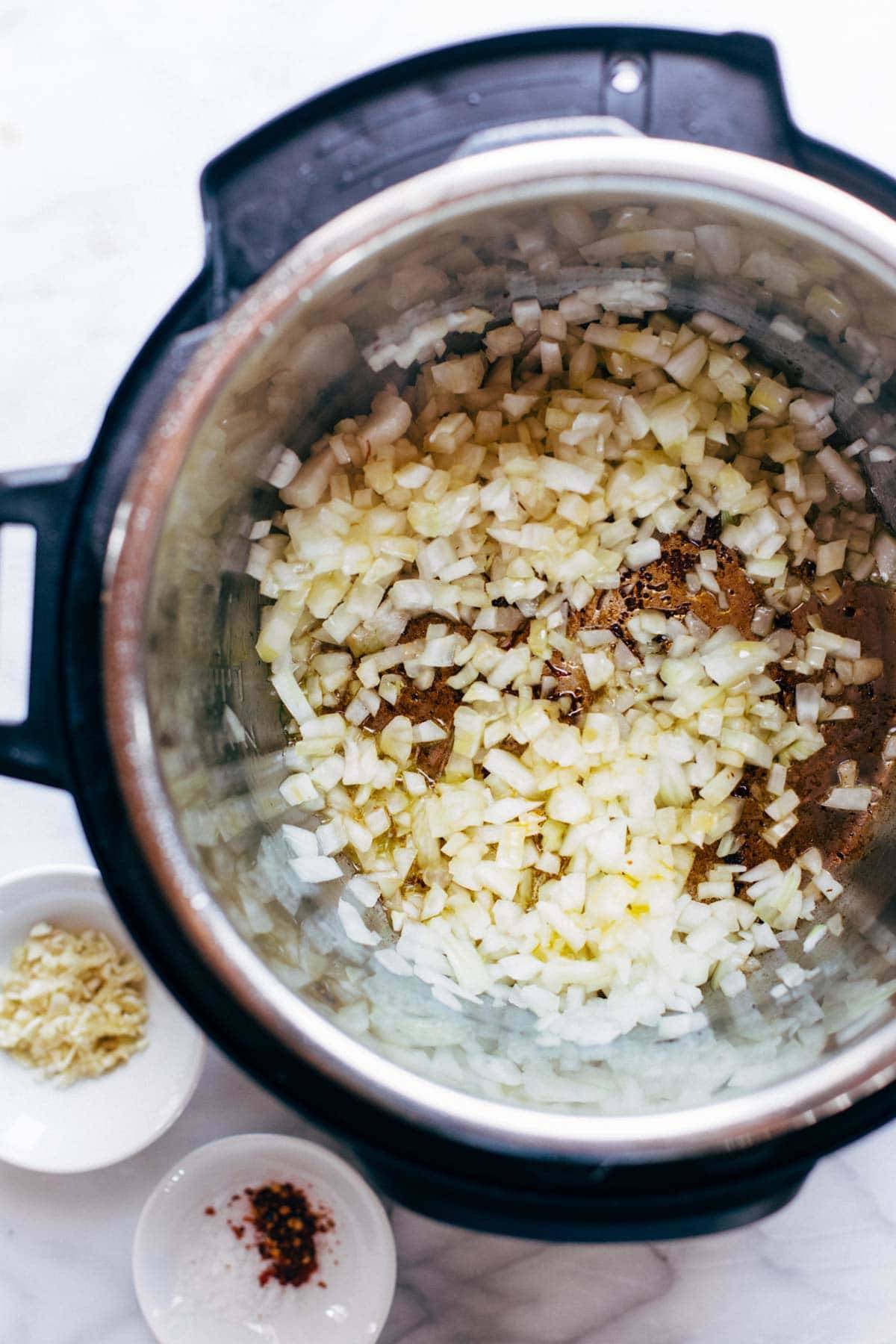 Short ribs and onions in an Instant Pot.