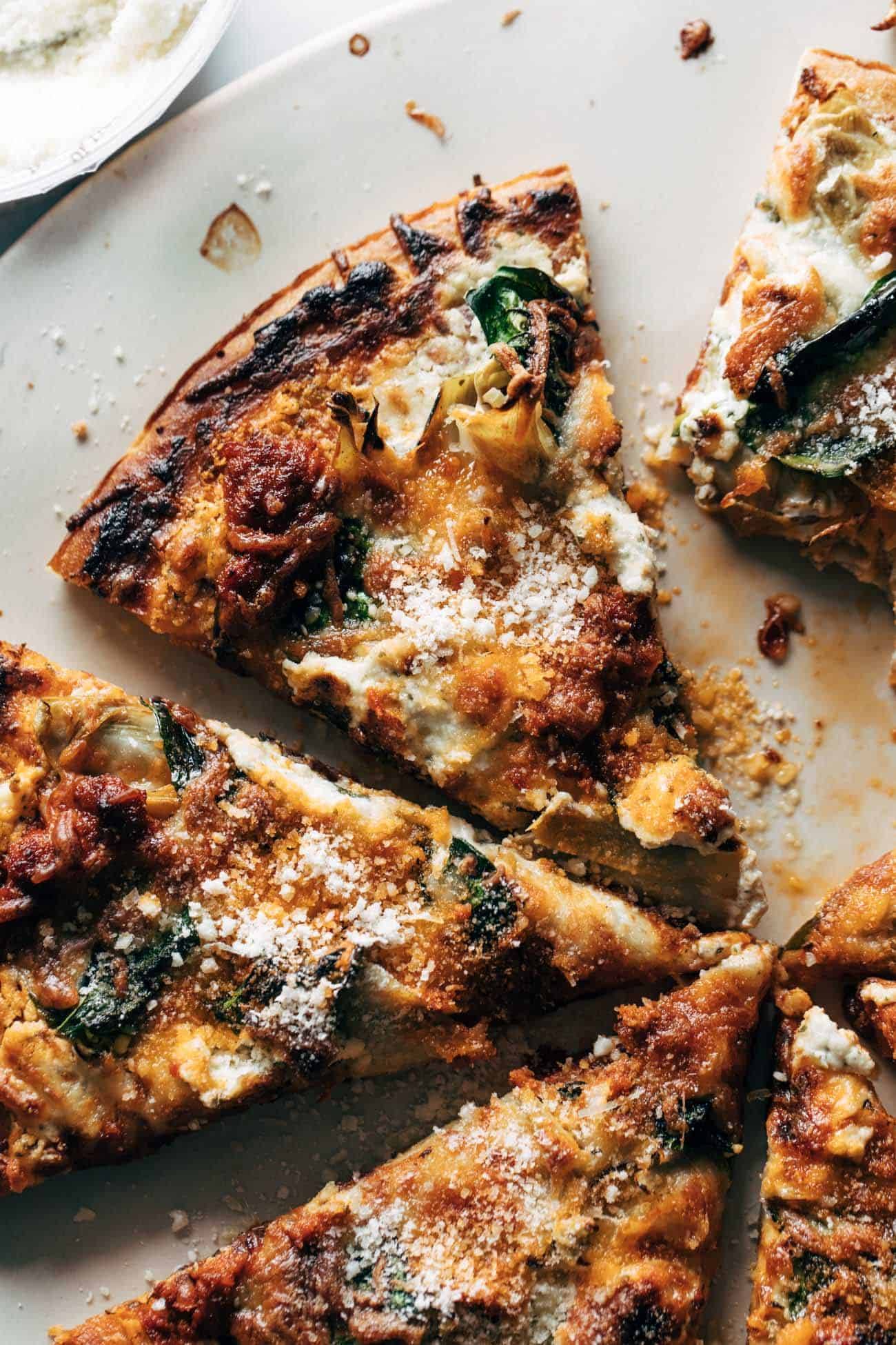 Close-up of spinach and artichoke pizza