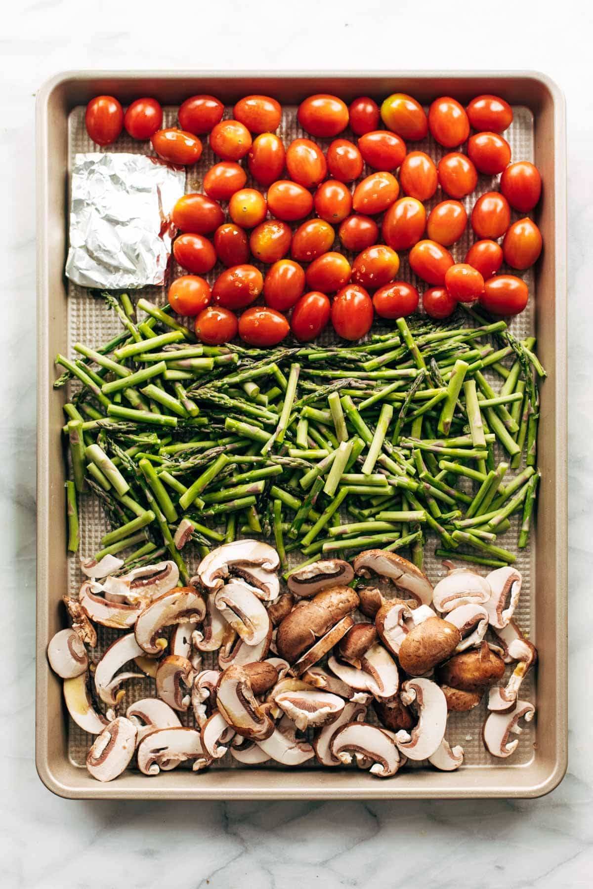 Vegetables on a sheet pan for roasting.