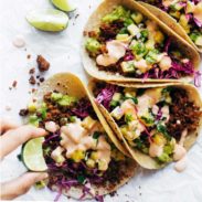 Walnut Chorizo Tacos with Pineapple Salsa in a row.